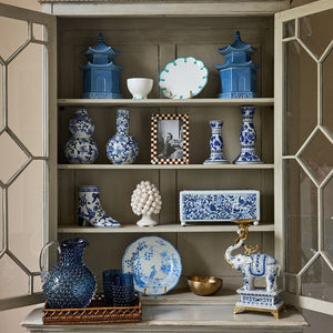 Rustic Brown Checked Photo Frame on the middle shelf of a glazed cabinet with blue and white china