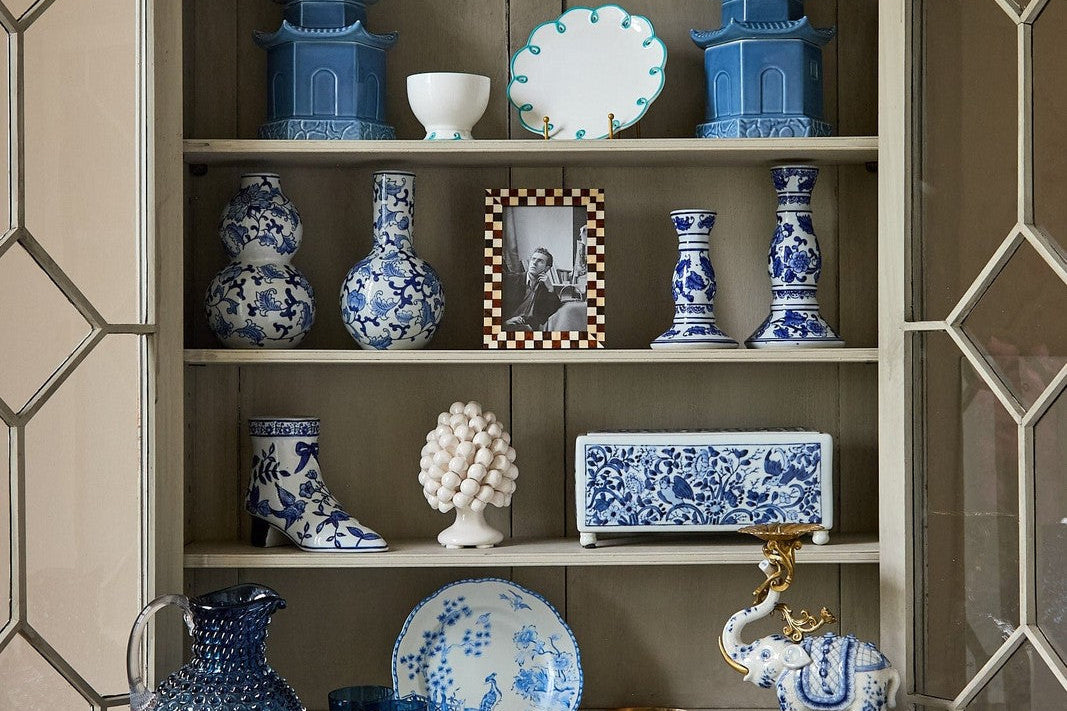 Rustic Brown Checked Photo Frame on the middle shelf of a glazed cabinet with blue and white china
