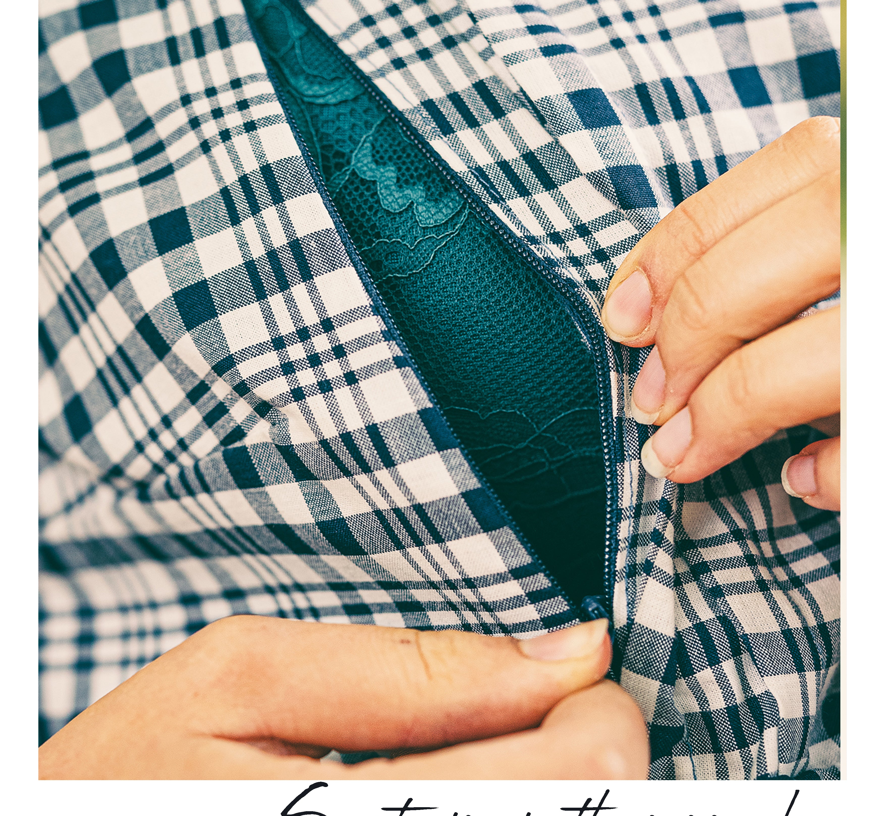 Close-up of a person's hands opening a dark teal zipper on a blue and white plaid garment, with the text 'Secret zips in the poppy dress' at the bottom.