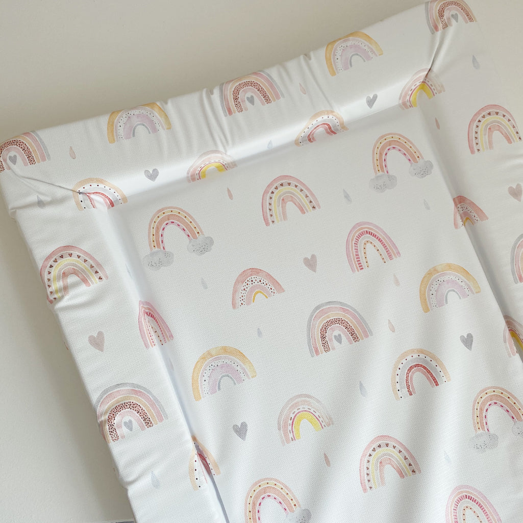 Standard Changing Mat Beau Rainbow Print close-up of the rainbow and heart pattern and the raised foam edges