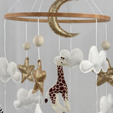 Safari Dreams Felt Cot Mobile close up of the gold glitter moon, stars, white clouds, giraffe and elephant