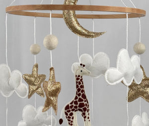 Safari Dreams Felt Cot Mobile close up of the gold glitter moon, stars, white clouds, giraffe and elephant