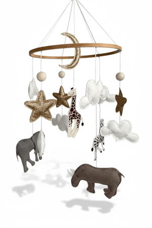 Safari Dreams Felt Cot Mobile on a white background, with a wooden ring, gold moon and stars, clouds and safari animals