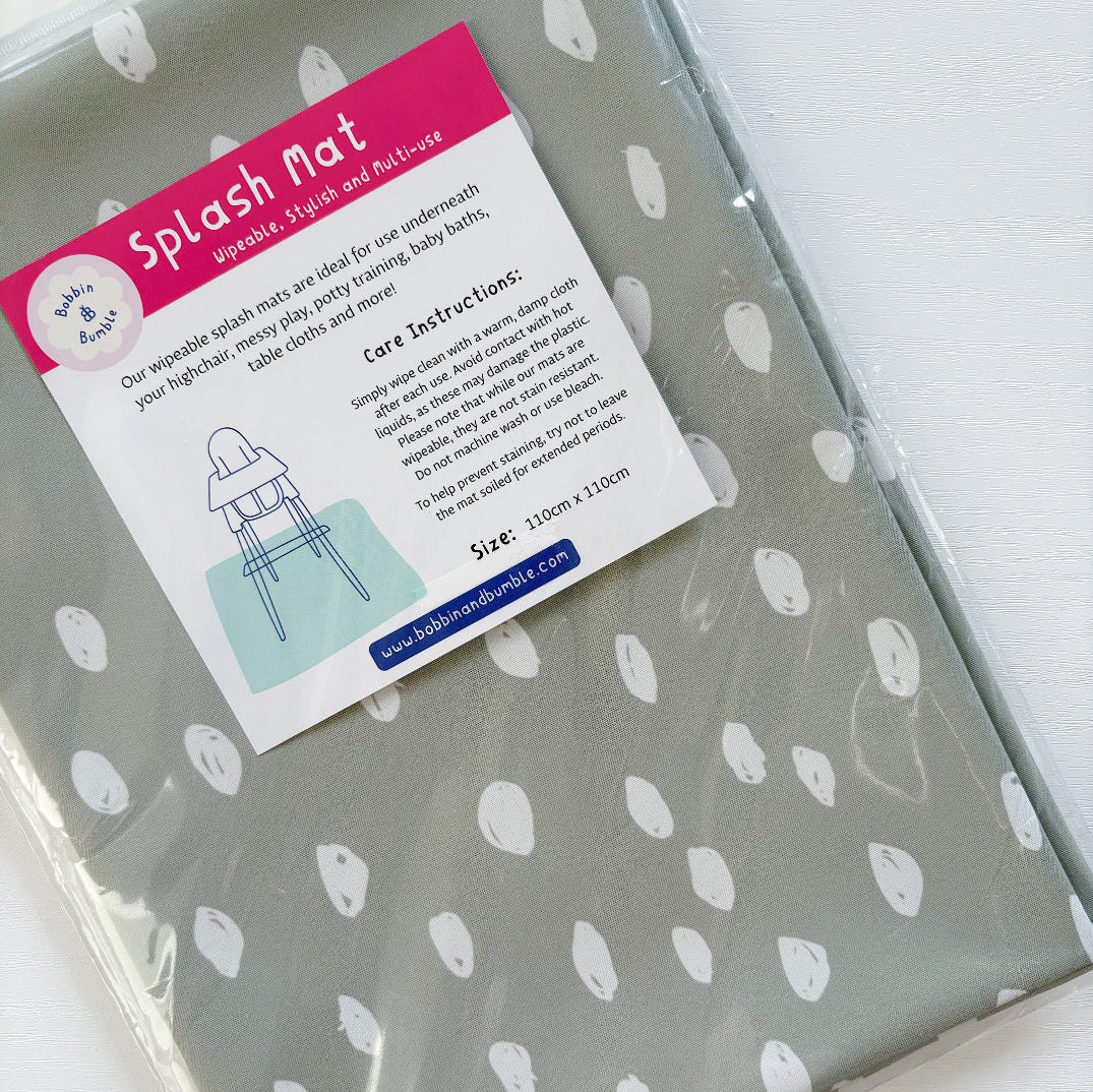 Splash Mat Sage Spots, in clear packaging with a label stating wipeable and size 110cm x 110cm