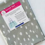 Splash Mat Sage Spots, in clear packaging with a label stating wipeable and size 110cm x 110cm