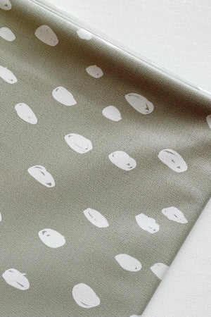 Splash Mat Sage Spots, angled close-up of the folded edge and the white spot print