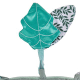 Sophie la girafe Cosy Play Cushion, close-up of the shiny green stitched leaf toy on a strap