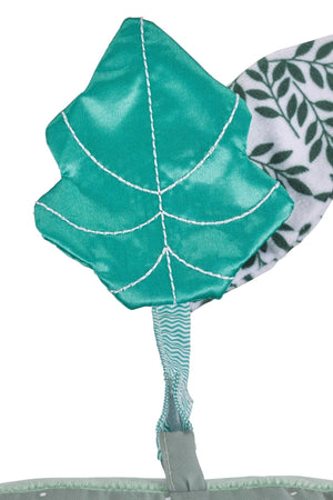 Sophie la girafe Cosy Play Cushion, close-up of the shiny green stitched leaf toy on a strap