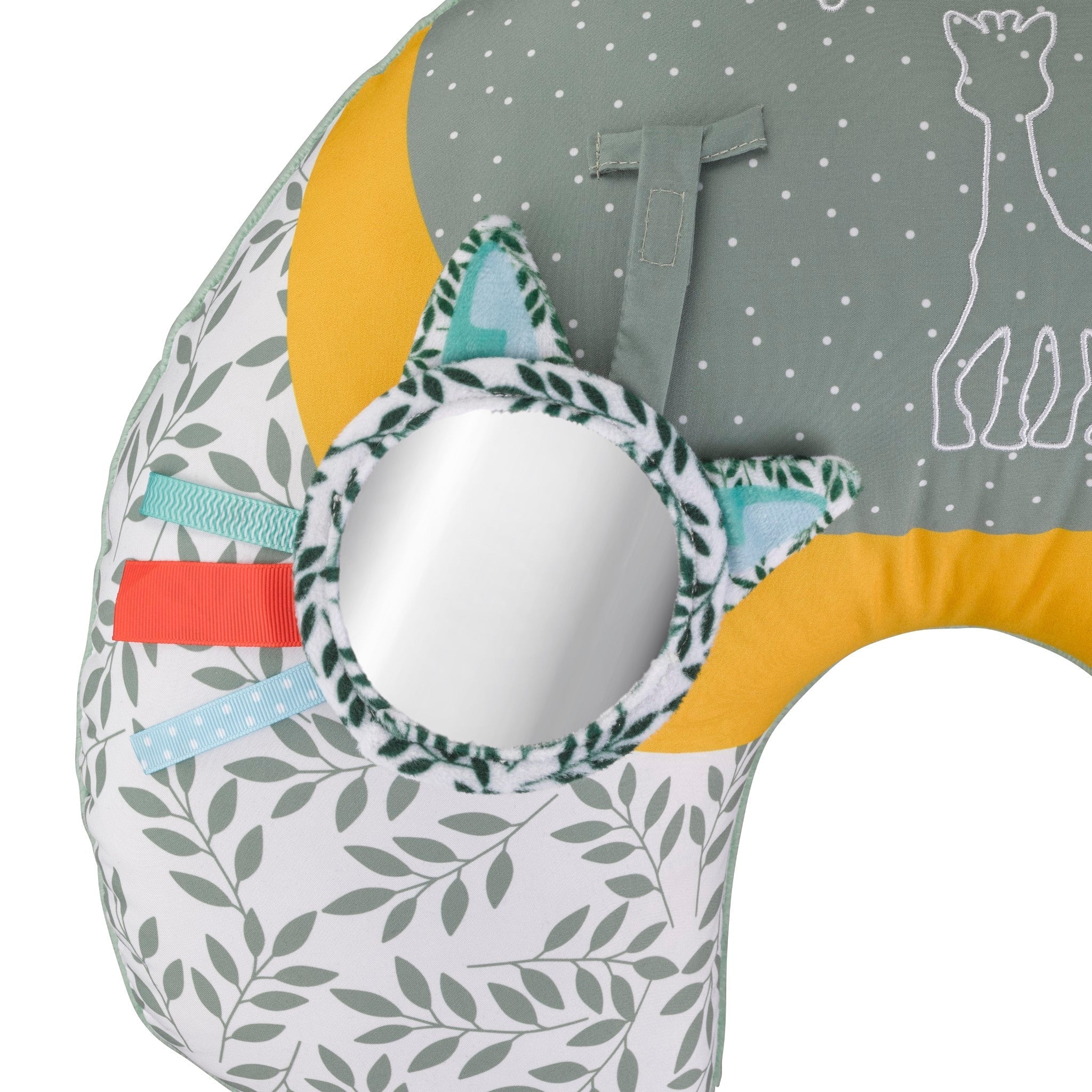Sophie la girafe Cosy Play Cushion, close-up of the round mirror with leaf print frame and coloured ribbon tags