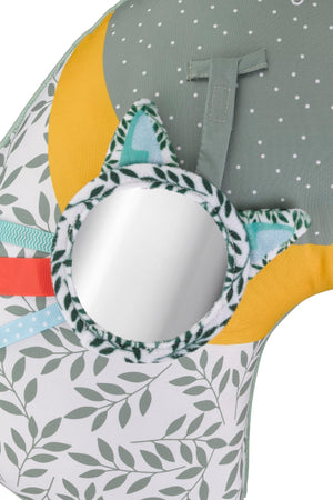 Sophie la girafe Cosy Play Cushion, close-up of the round mirror with leaf print frame and coloured ribbon tags