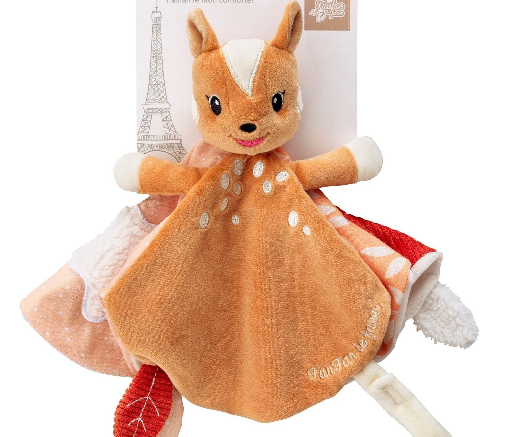 FanFan the Fawn Comforter, orange, in its packaging with a card marked 3m+ and an Eiffel Tower drawing
