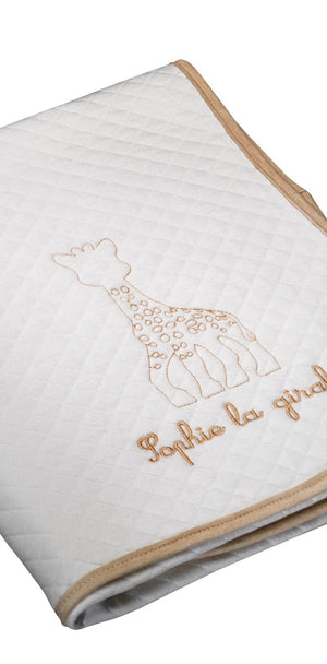 Sophie la girafe My Birth Outfit Gift Set folded white quilted blanket with embroidered giraffe and tan edging