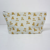 Teddy Bear Print nappy wallet, front view of the zipped pouch covered in small seated teddy bears on a pale background