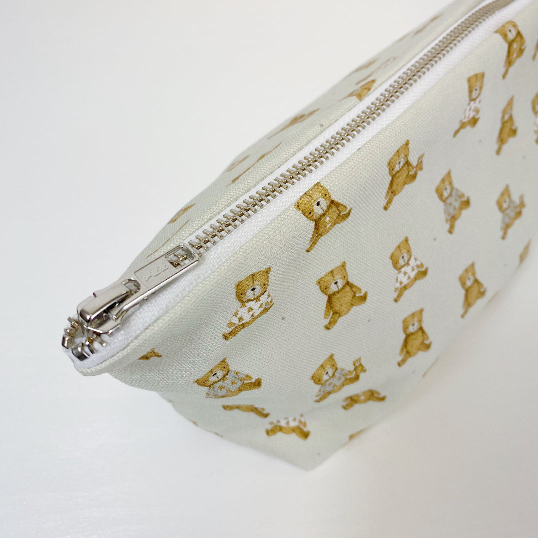 Teddy Bear Print nappy wallet, close-up of the silver zip and puller at the top corner of the pouch