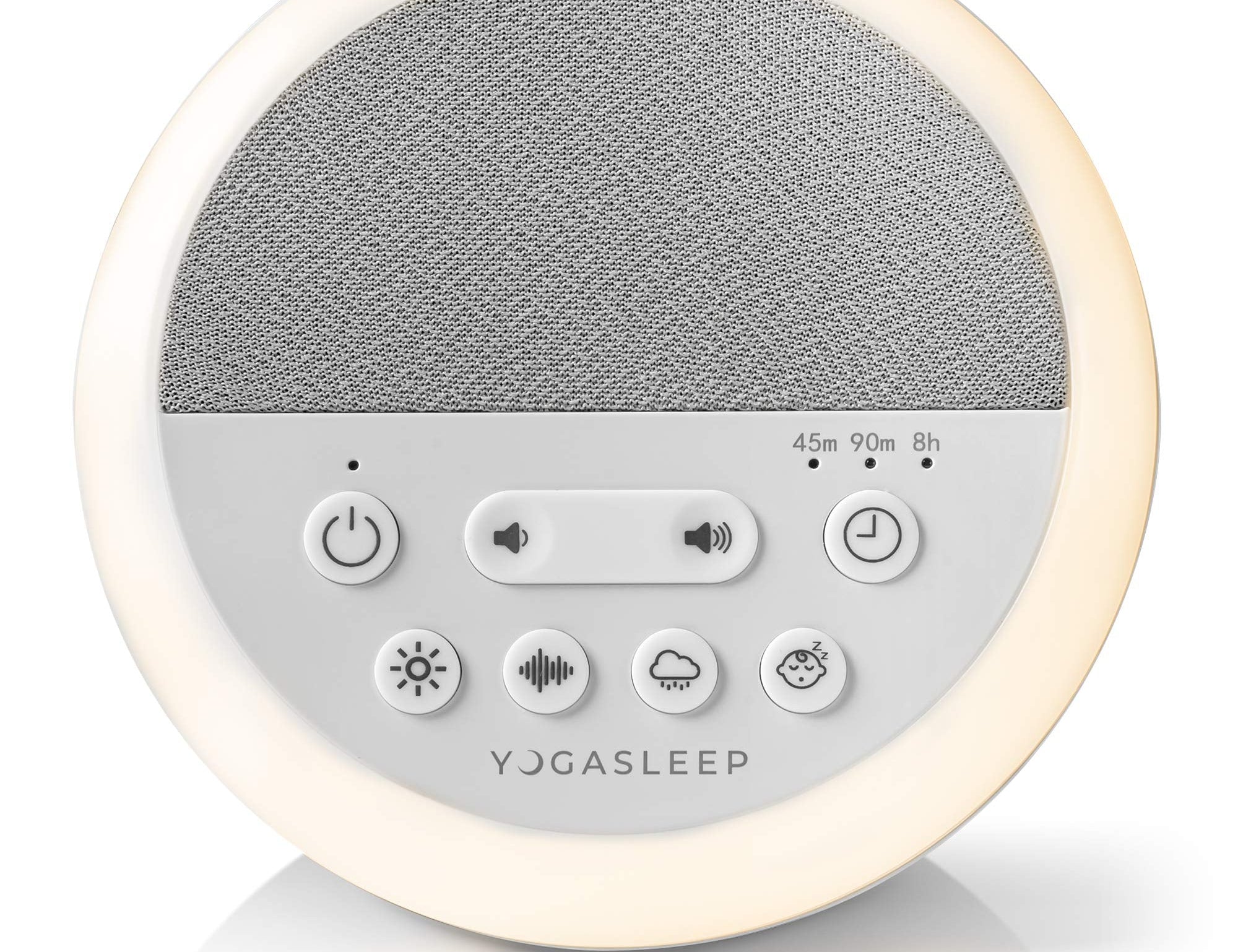 Yogasleep Nod white noise sound machine glowing with its soft amber night light